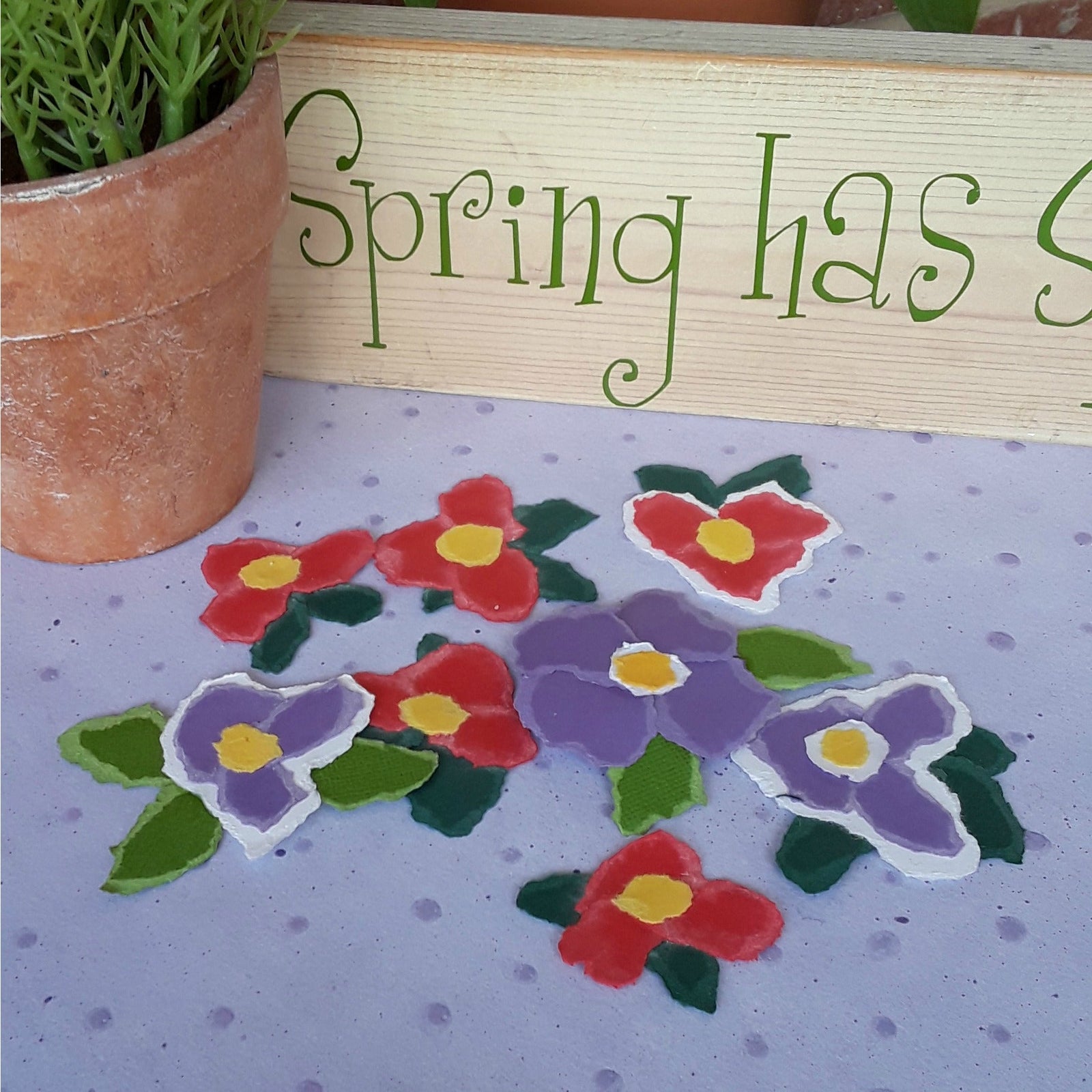 Torn paper flowers for decorating cards or scrapbook pages.