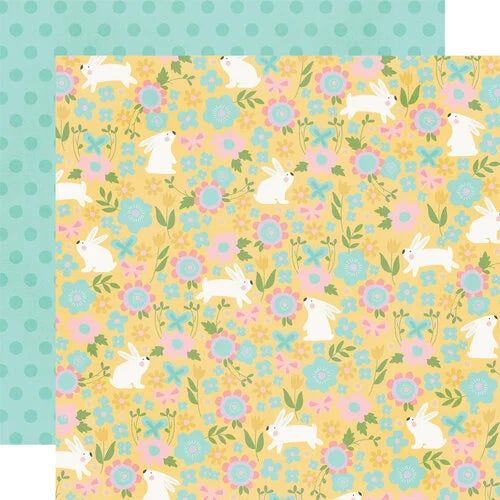 Patterned paper with bunnies and flowers on a yellow background with mint green polka dot reverse.