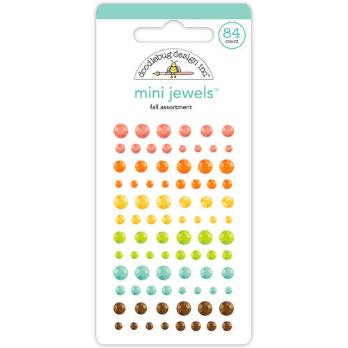 Packaged mini jewels with a variety of colors on a white background