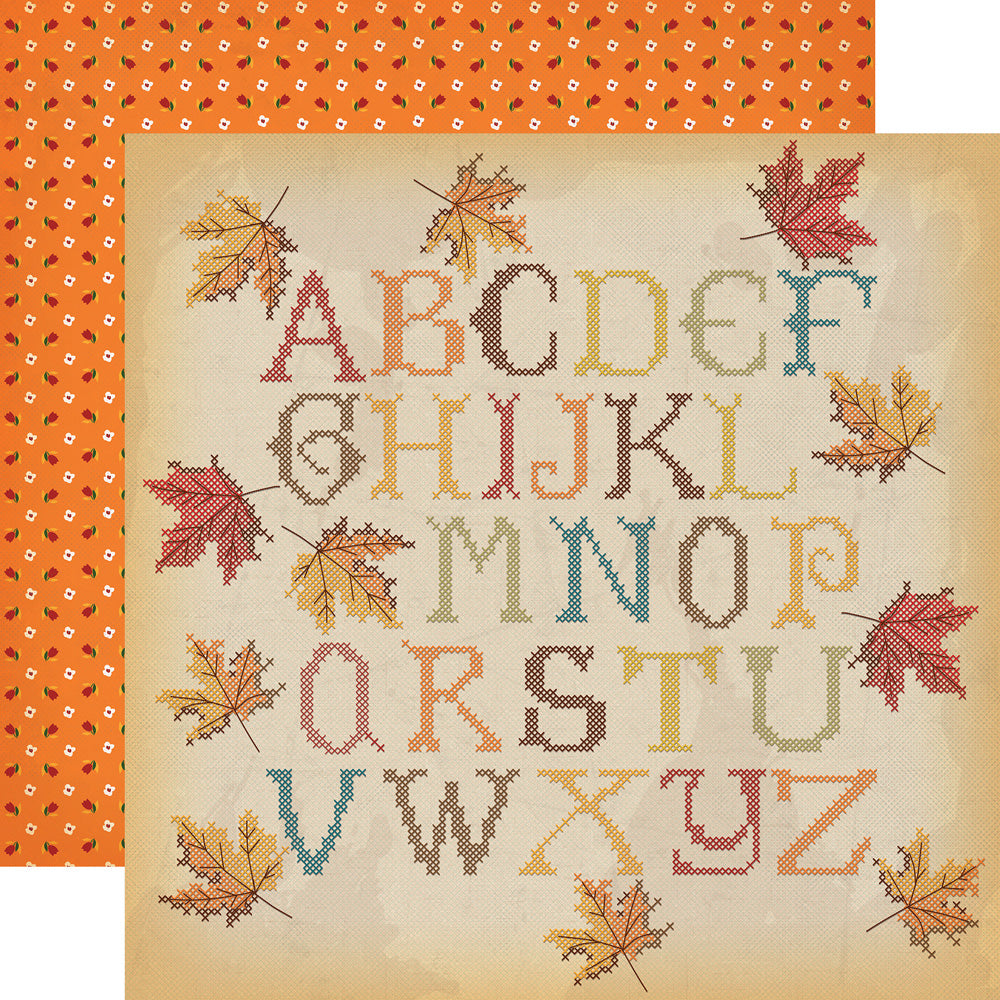 (Side A - a stitched alphabet with autumn leaves in fall colors on a cream background; Side B - tiny red and white flowers on an orange background)