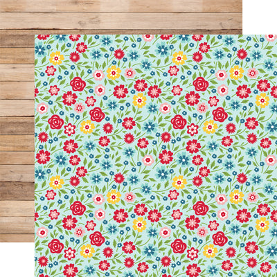 12x12 double-sided patterned paper. (Side A - red, blue, yellow, and pink floral on a pastel blue background; Side B - realistic woodgrain planks)