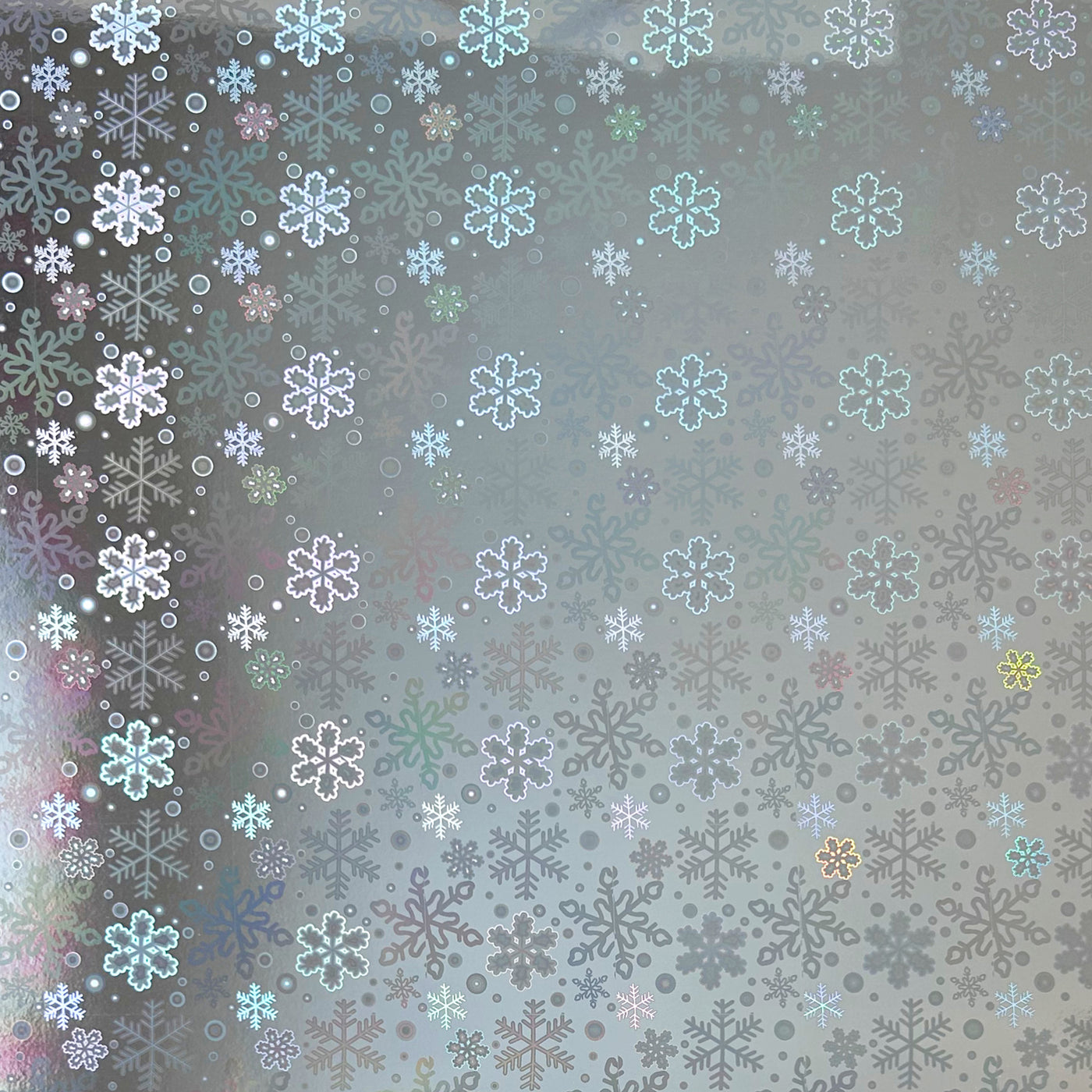 Snow Flurries Holographic Cardstock - 12x12 silver holographic cardstock with a snowflake pattern