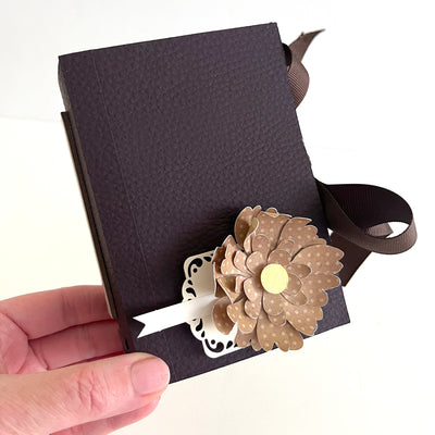 handmade book favor featuring brown leather like cardstock