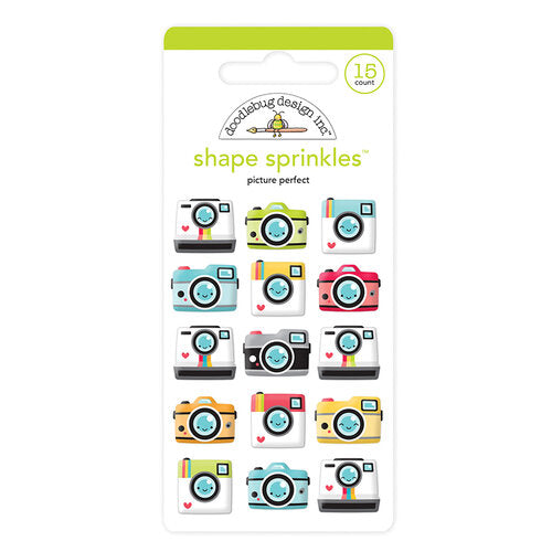 This package includes cameras. Assorted shapes come in multiple colors and sizes from Doodlebug Design.