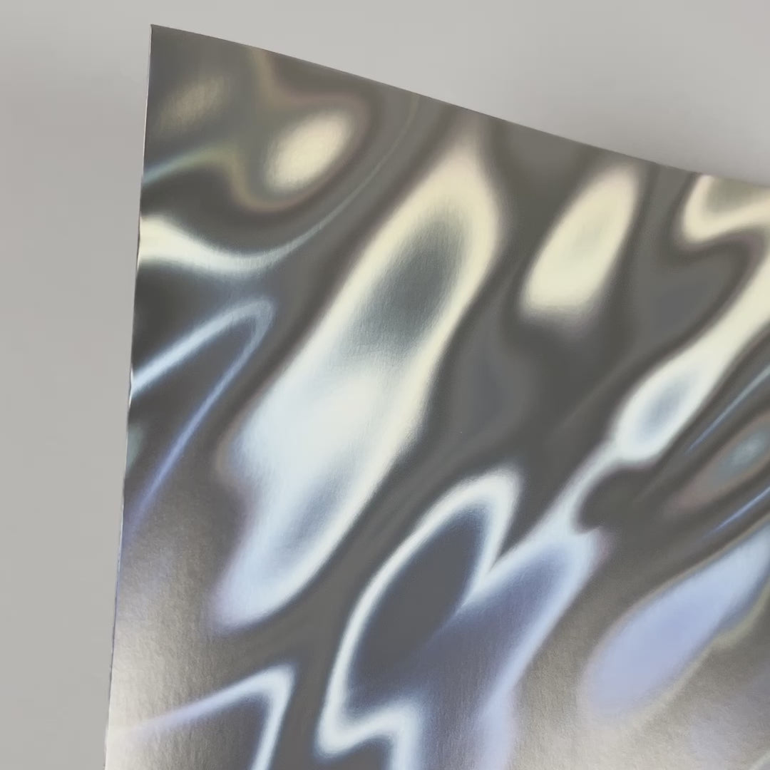Mirri Lava Matte Silver Holographic Cardstock with a flowing lava pattern