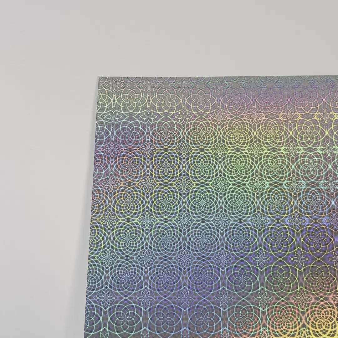 Silver holographic cardstock with a flower pattern