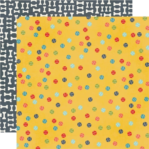 (Side A - tennis balls in various colors on a yellow background, Side B - dog bones all over on a navy blue background)