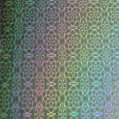 Close-up of holographic 12x12 cardstock with silver flower design