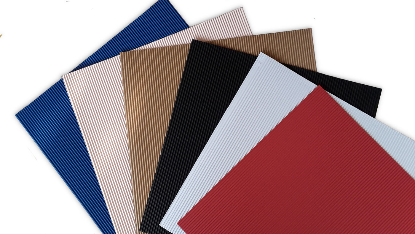 Fan array of six colors of 12x12 corrugated specialty paper from DCWV