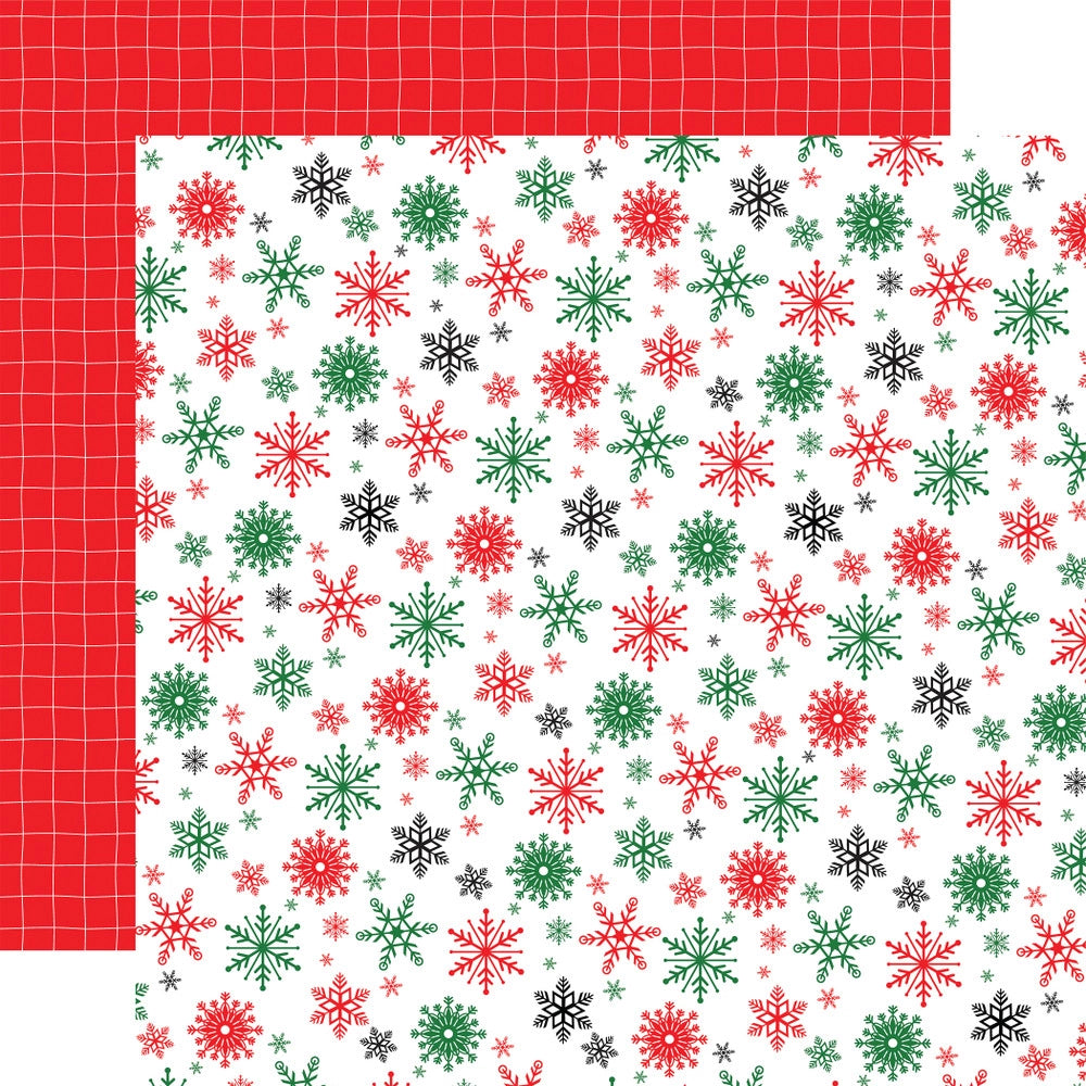 Double-sided 12x12 cardstock with red, green, and black snowflakes on a white background; the reverse is white pinstripe plaid on a red background.