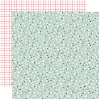 The front side of this paper has a floral pattern in a mint green shade. The reverse side is light pink with a grid pattern.