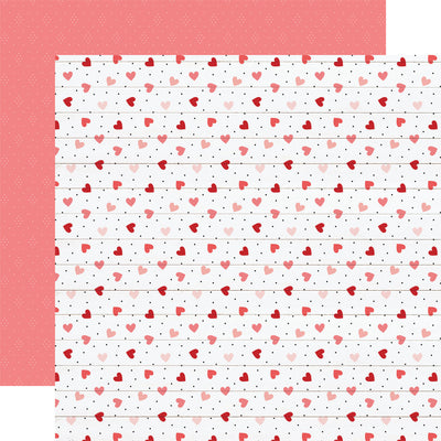 Multi-Colored (Side A - scattered red and pink hearts with little black polka dots on a white-washed wood plank background, Side B - faint white dots forming a diamond pattern on a blush pink background)