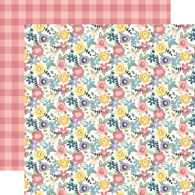 The front side of this paper is full of pink, purple, yellow, and blue flowers. The reverse side is a pink on pink gingham pattern.