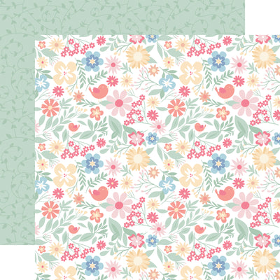 The front side of this paper is full of pastel colored flowers and the reverse side is green with a swirling leaf pattern. 