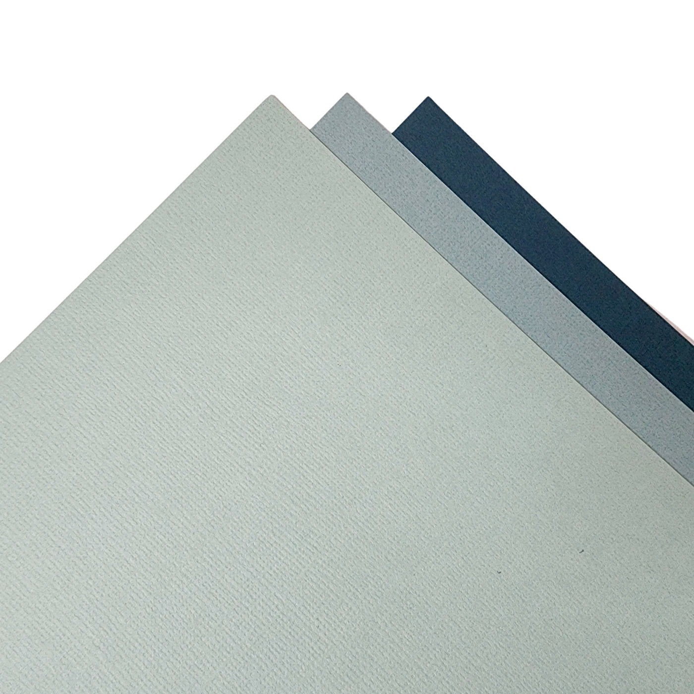 The Blue-Green monochromatic assortment includes three (3) each of four (3) shades of blue-green colors of Bazzill textured cardstock.