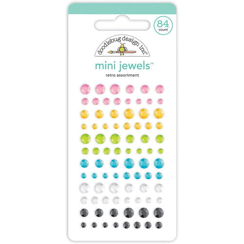 Eighty-four self-adhesive rhinestones in rainbow colors, small, medium and large sizes, from Doodlebug Design.