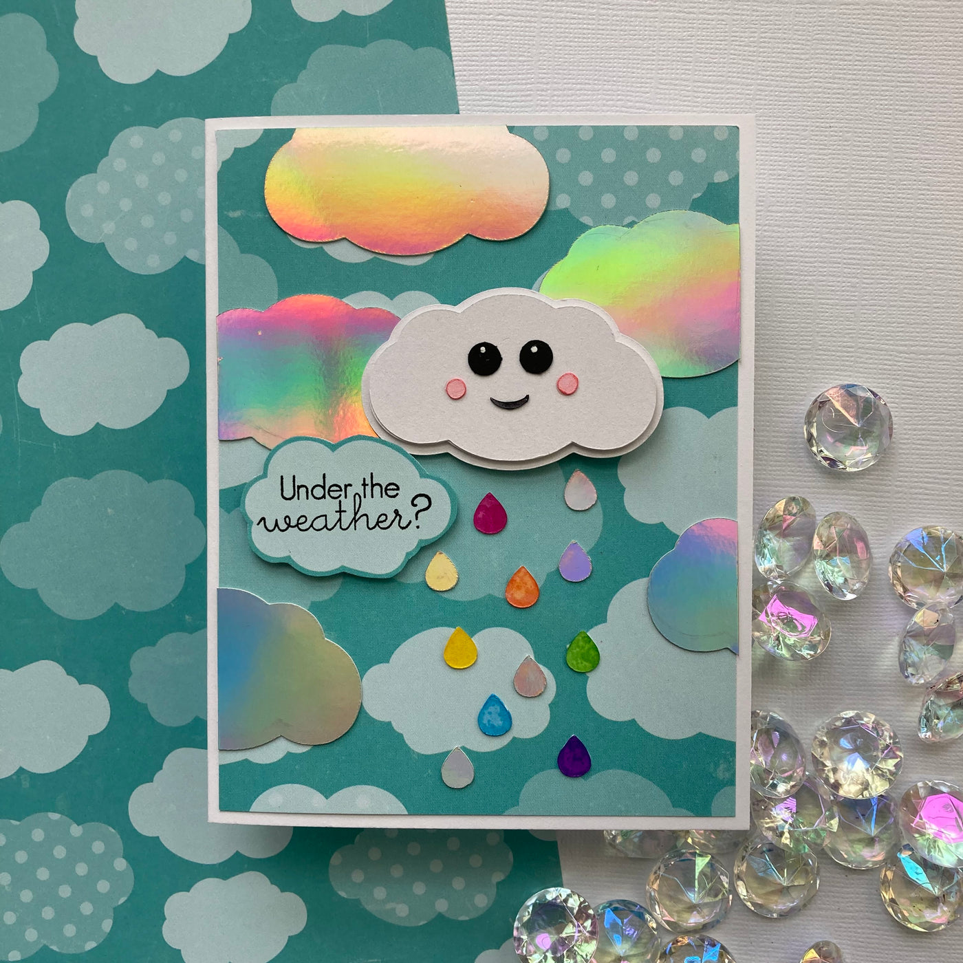 handmade card featuring rainclouds with holographic cardstock