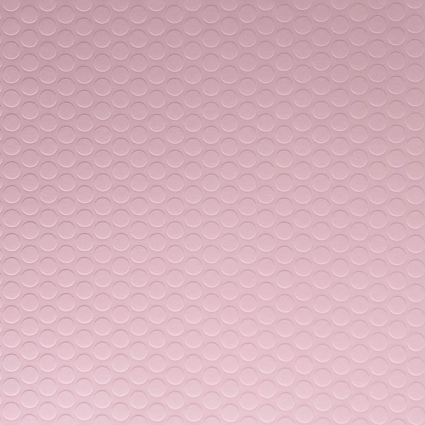Pastel pink cardstock with raised embossed pink dots. 